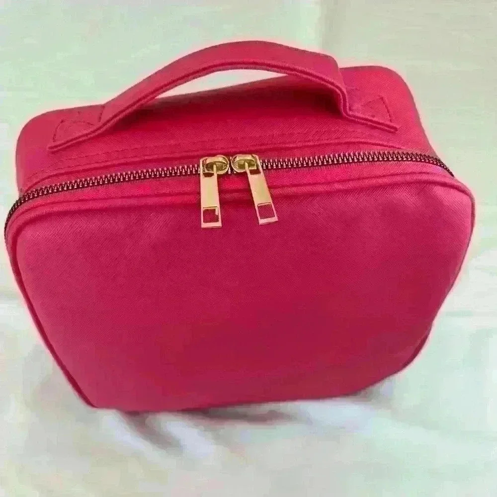 Hot pink faux leather travel makeup case with gold hardware. NWOT.